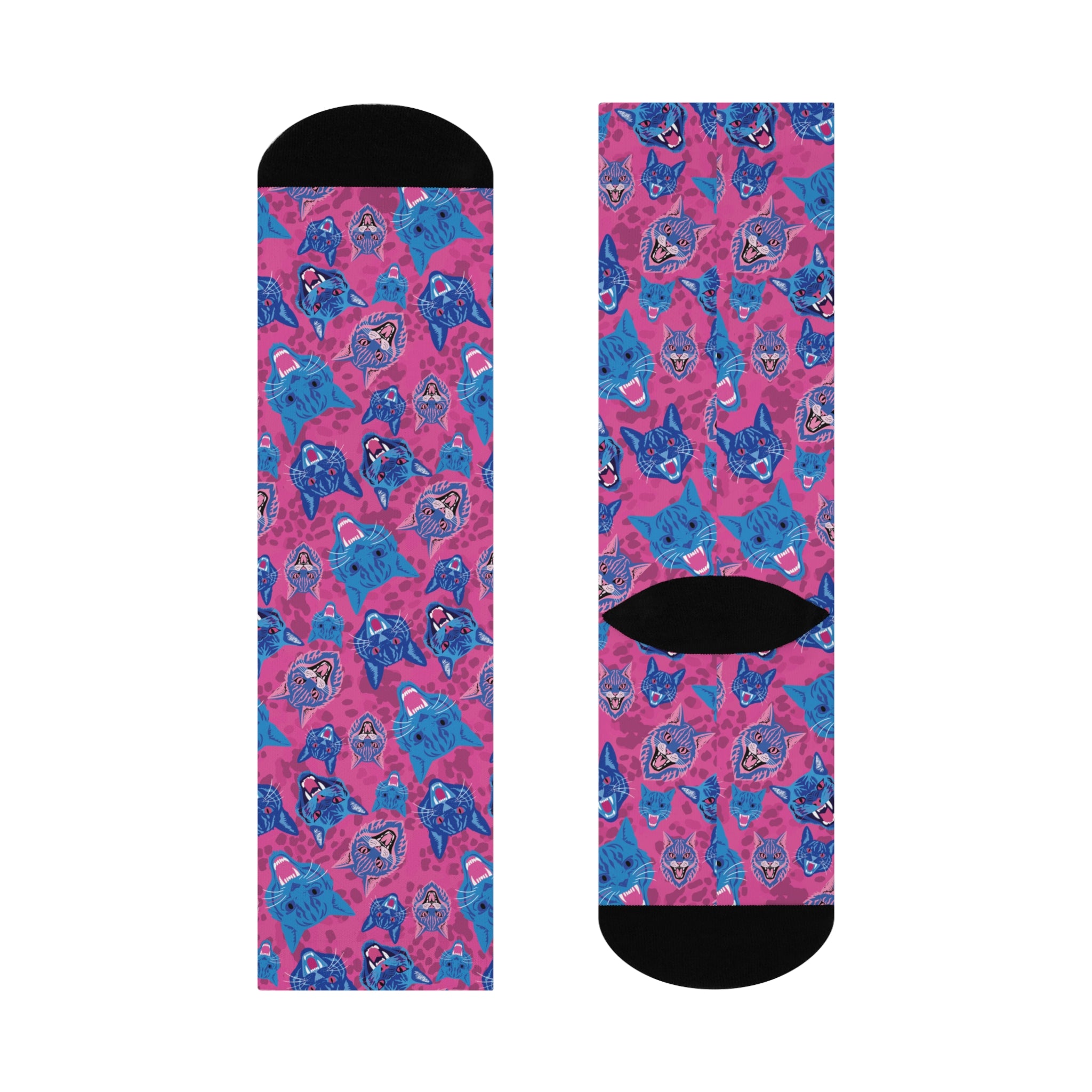 Fun and playful socks adorned with vibrant tiger head motifs on a pink background, with black heels and toes, ideal for animal lovers and those who enjoy unique designs