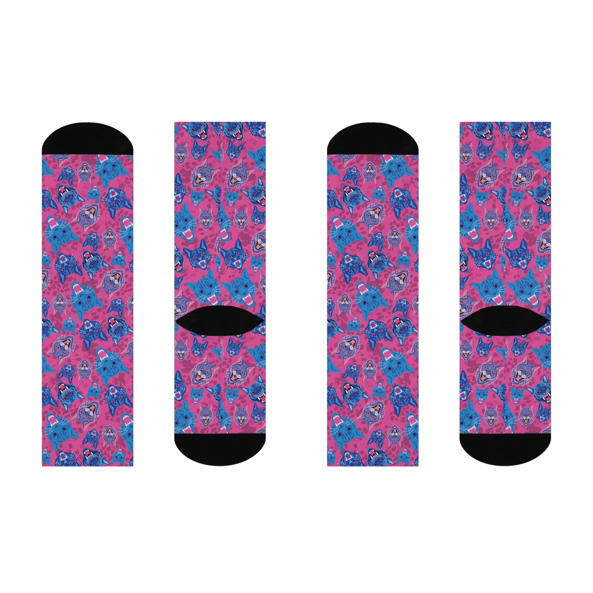 Fun and playful socks adorned with vibrant tiger head motifs on a pink background, with black heels and toes, ideal for animal lovers and those who enjoy unique designs