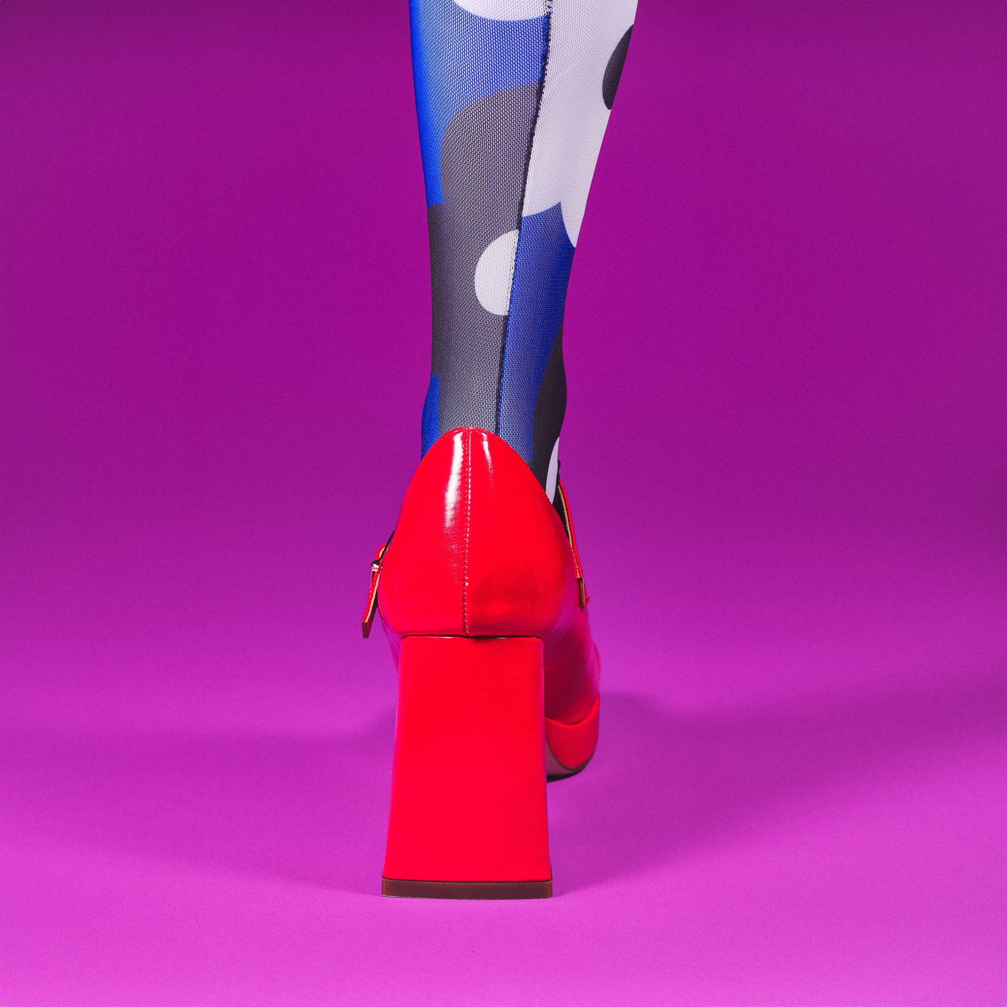 a woman's legs in tights and high heels