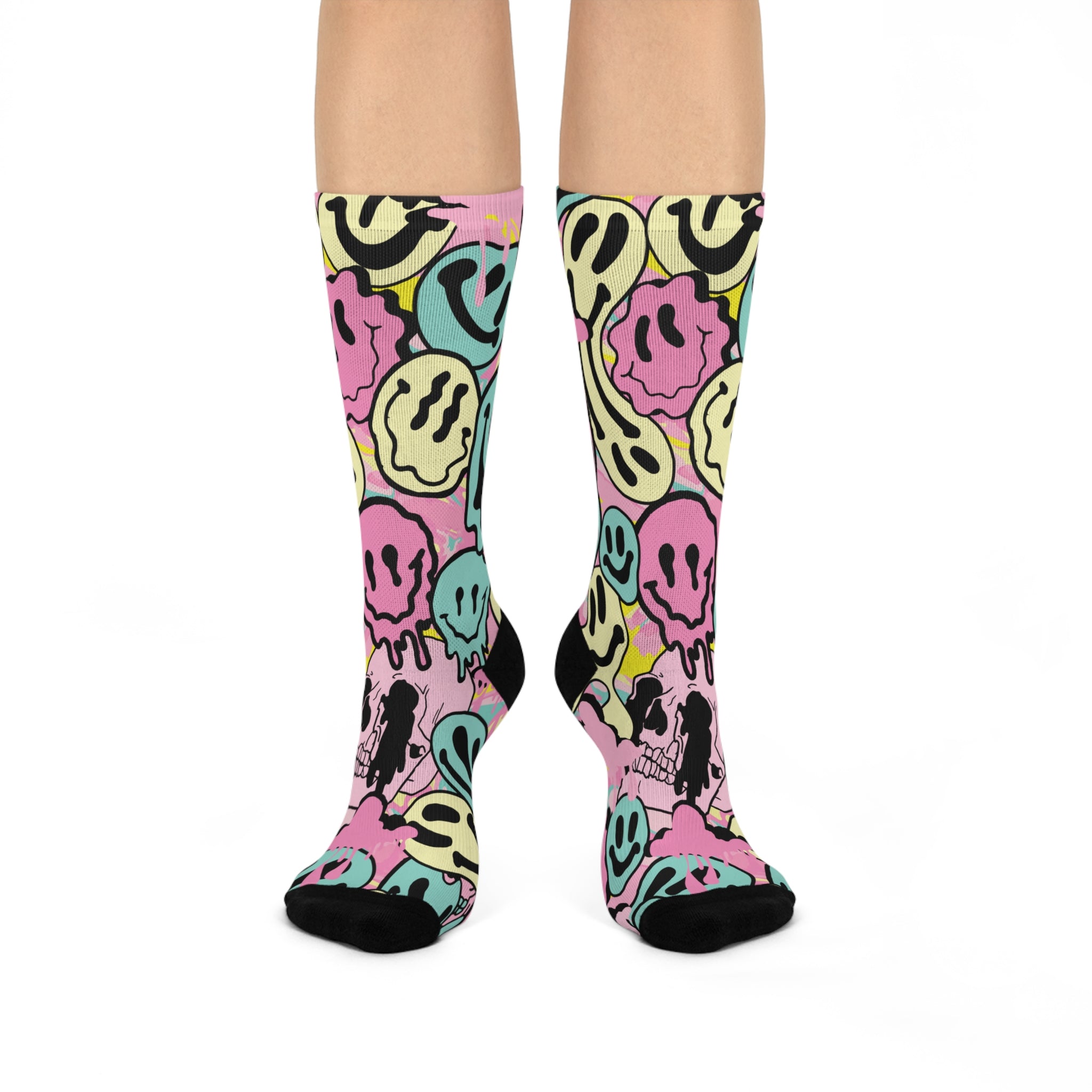 Fun and vibrant socks adorned with a 90s-inspired design of melting smiley faces in various colors, with black heels and toes, perfect for those who love retro and unique styles.