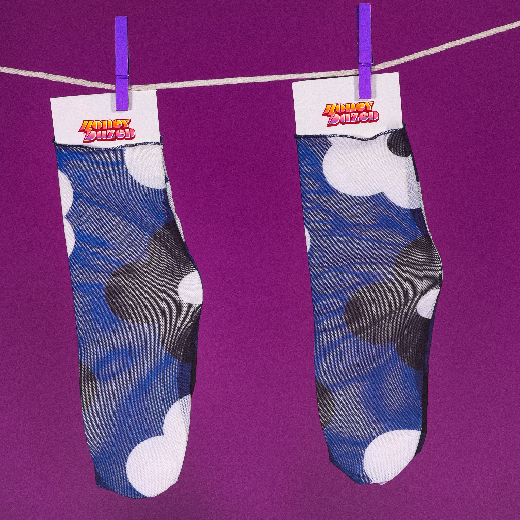a pair of socks hanging from a clothes line