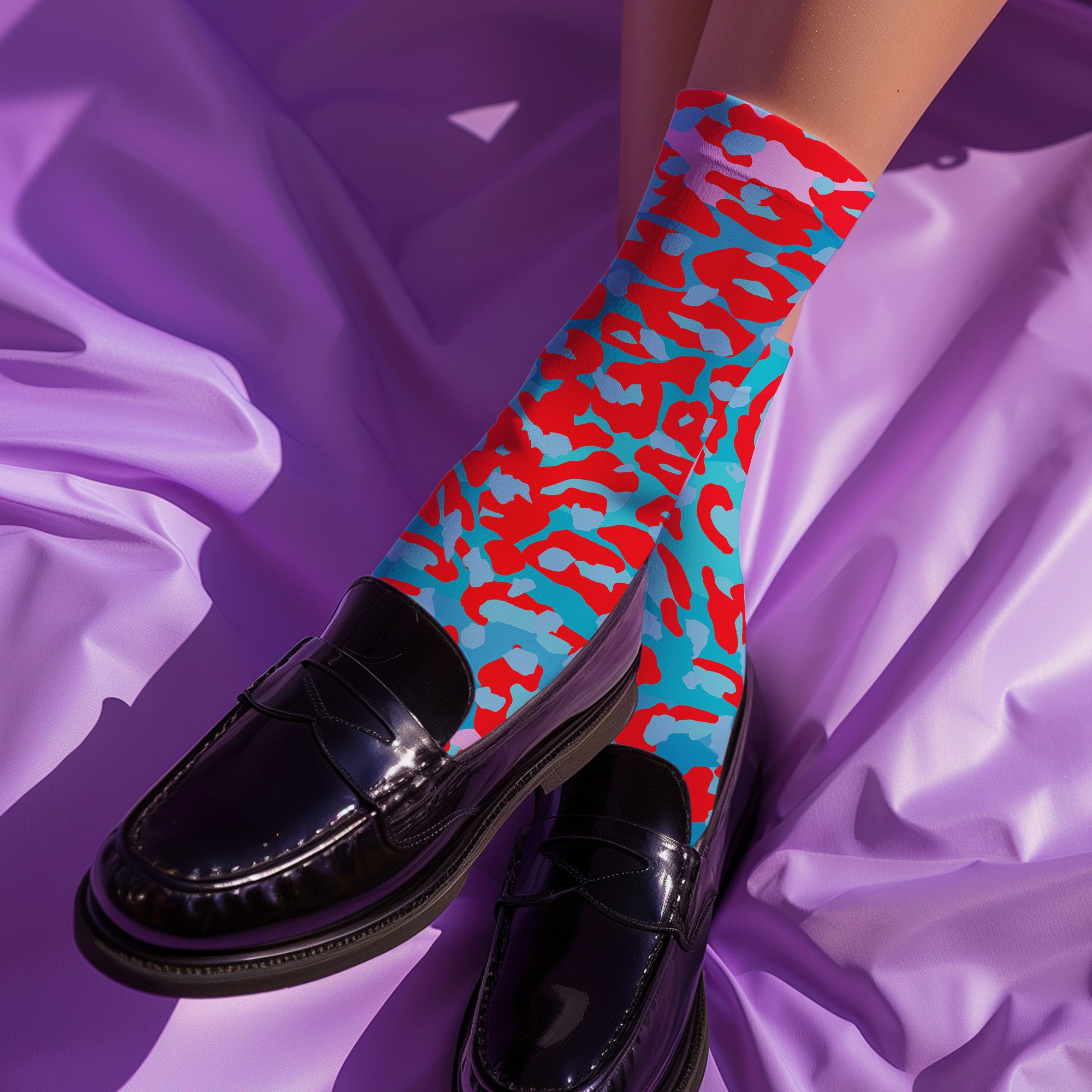Dive into bold fashion with these vibrant socks featuring an eye-catching red, blue, and pink cheetah print pattern. Perfect for those who love to make a statement, these socks are ideal for brightening up any outfit and showcasing your unique style. Comfortable and stylish with black heels and toes, they are a must-have accessory for the fashion-forward.