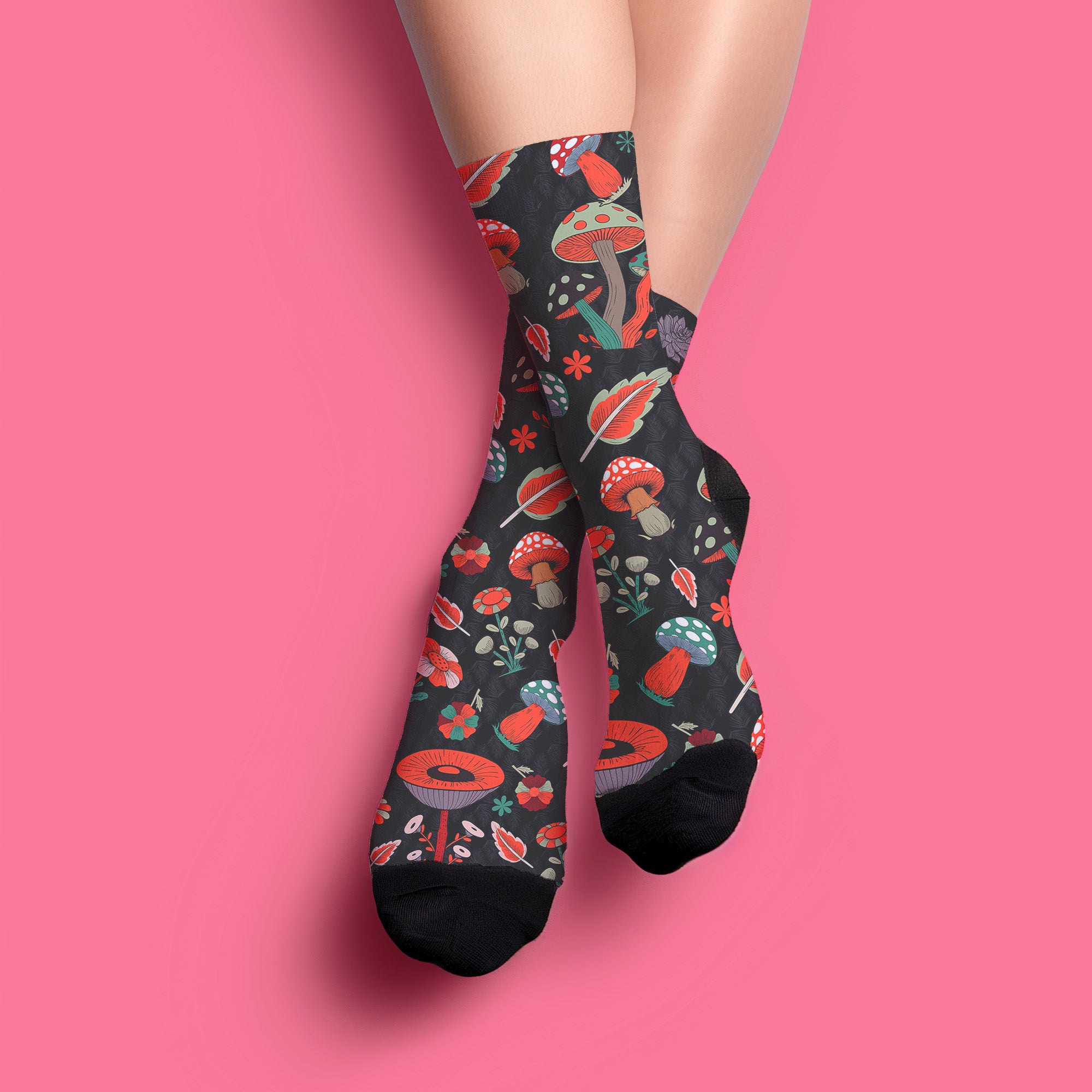 Stylish black socks with a vibrant pattern of mushrooms and nature elements, featuring black heels and toes, ideal for those who appreciate quirky and whimsical designs.