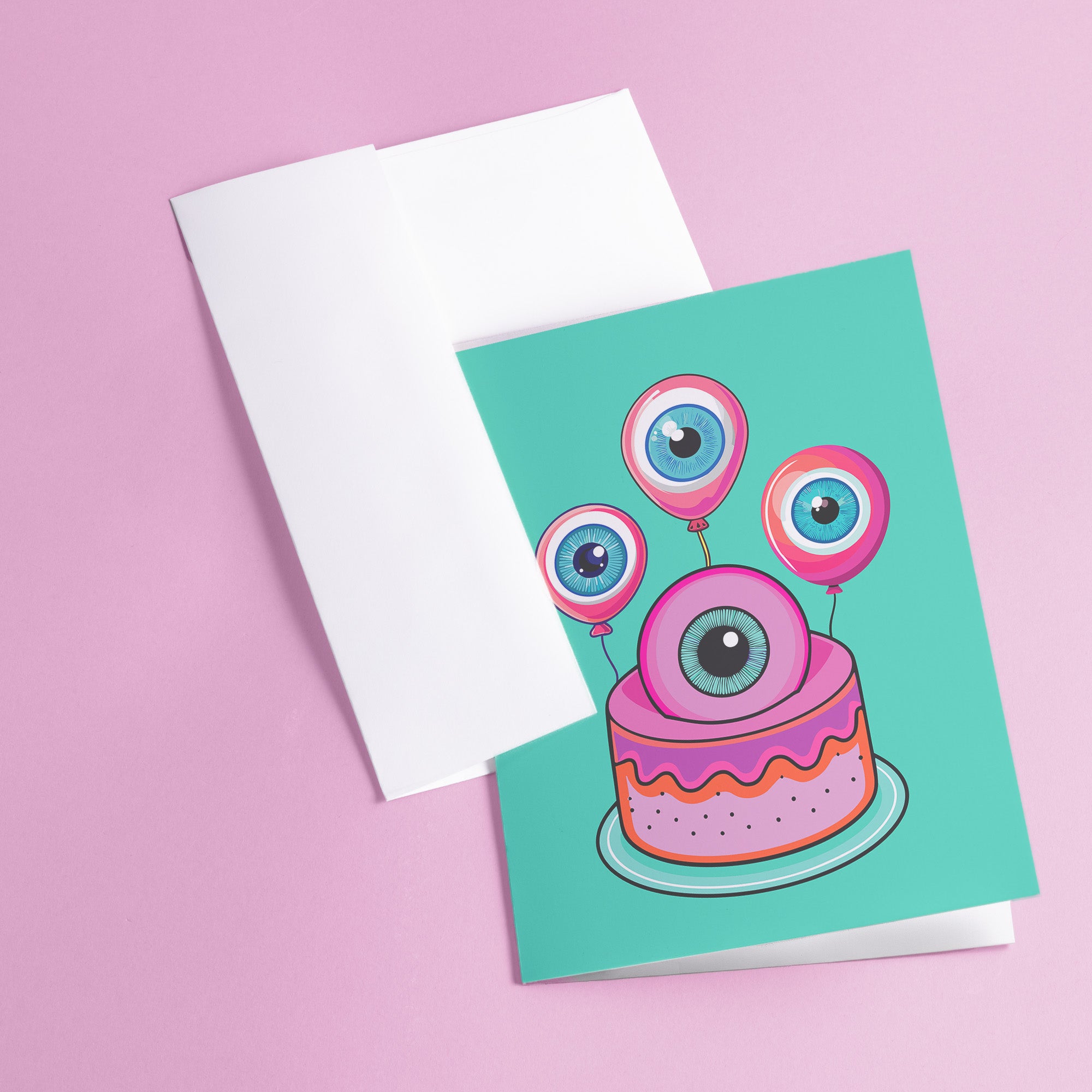 Quirky birthday card with teal background. Pink-purple cake topped by large cartoon eyeball. Three eyeball-shaped balloons float above, each with blue iris and pink edges. Inside message: 