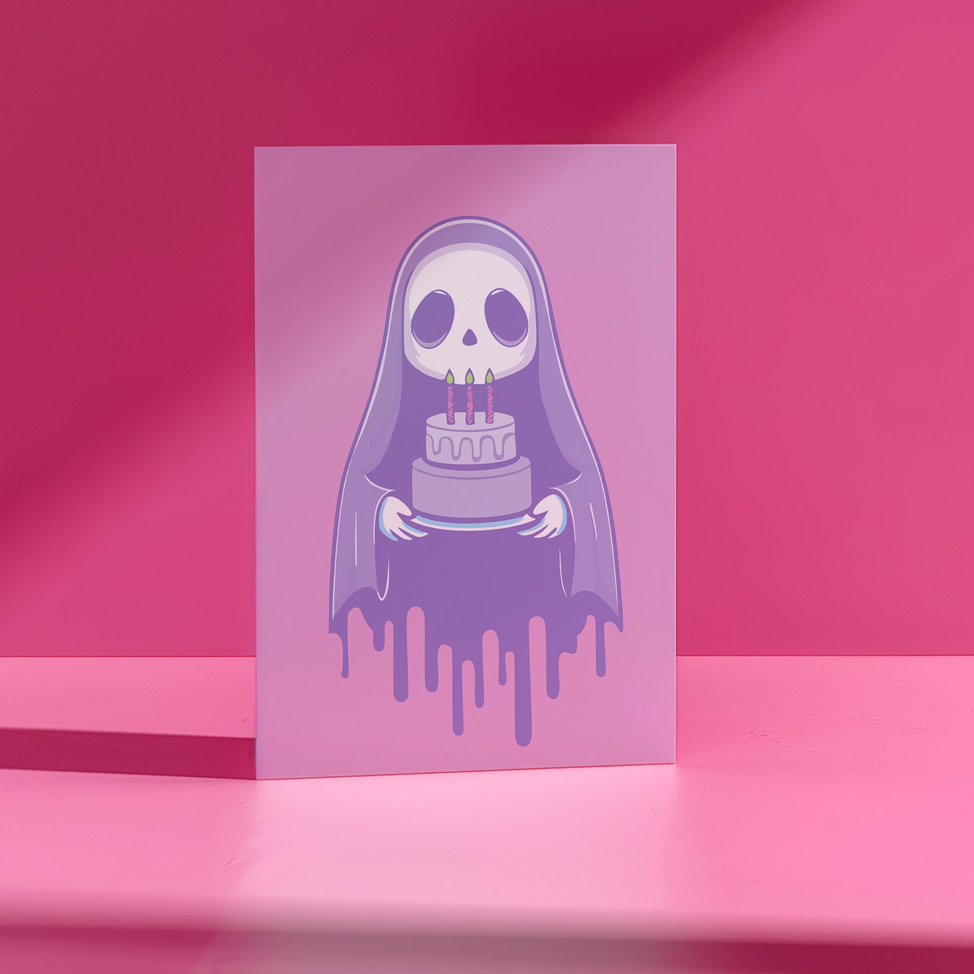 Birthday card featuring a cute cartoon grim reaper holding a birthday cake on pink background. The reaper wears a purple cloak and has a white skull face. It's carrying a small purple cake with three lit candles. The reaper's cloak drips like melting icing at the bottom. Ideal for Halloween birthdays or gothic-themed celebrations. Inside greeting: 