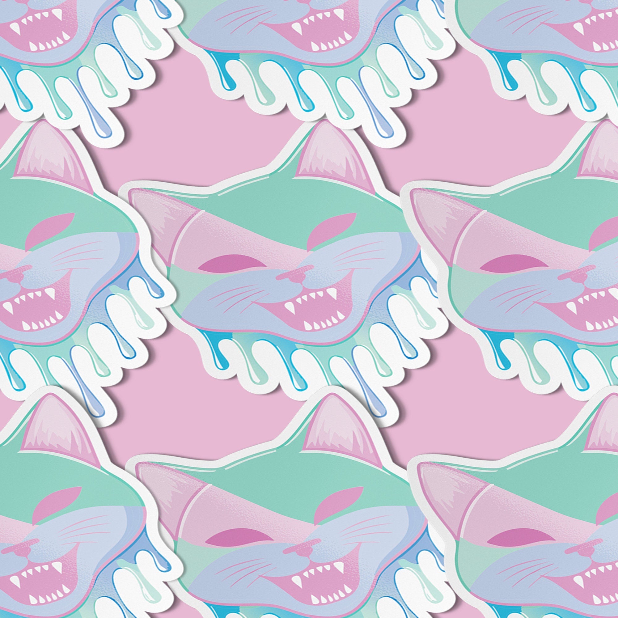 Adorable pastel kitty sticker with a cheeky fanged smile, perfect for adding a playful touch to your accessories. Available in Prism, Gem, and Glitter finishes. Handmade in Austin, Texas.