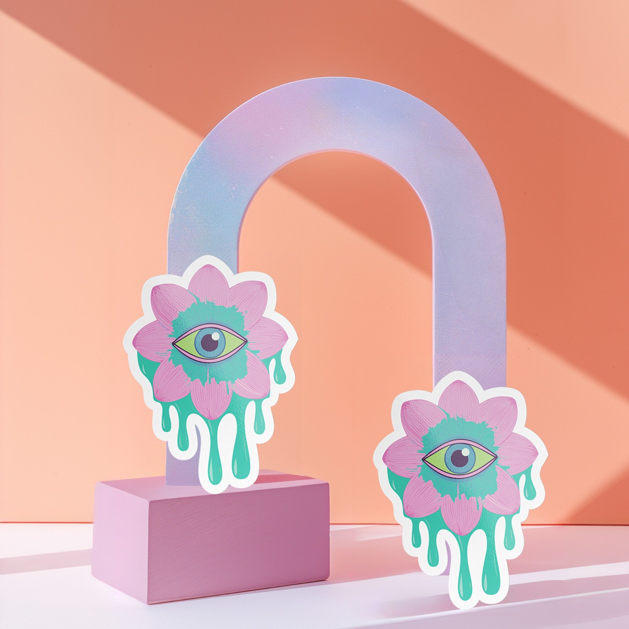 Trippy eyeball flower sticker in pastel pink and green, ideal for quirky and weirdcore enthusiasts. Available in Prism, Gem, and Glitter finishes. Handmade in Austin, Texas.