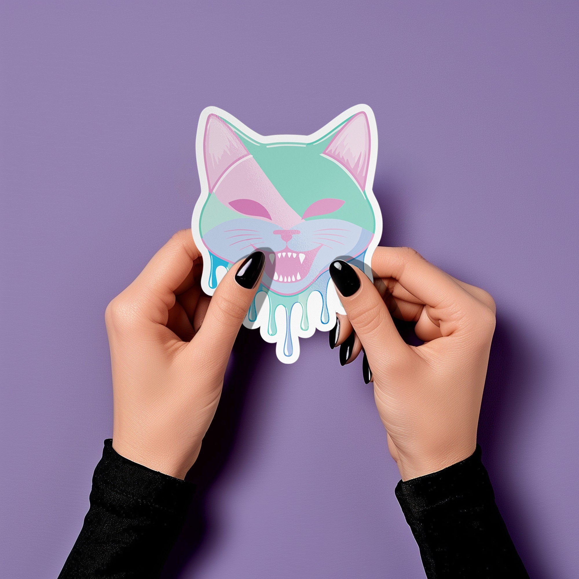 Adorable pastel kitty sticker with a cheeky fanged smile, perfect for adding a playful touch to your accessories. Available in Prism, Gem, and Glitter finishes. Handmade in Austin, Texas.