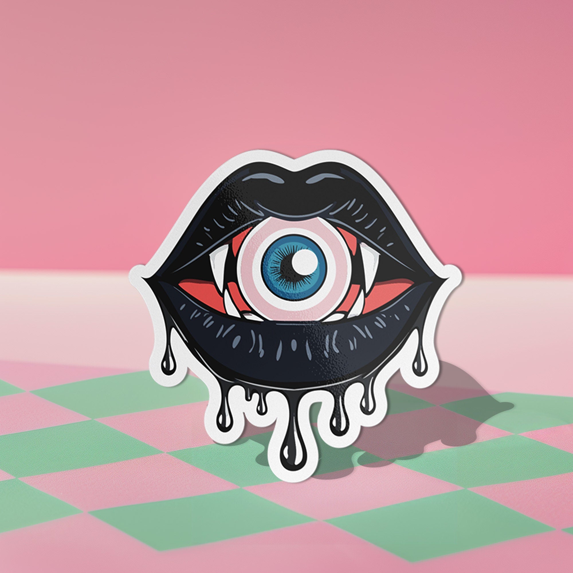 Eyeball vampire fangs sticker with black lips, perfect for adding a spooky touch to laptops, phones, and water bottles. Available in Prism, Gem, and Glitter finishes. Handmade in Austin, Texas.