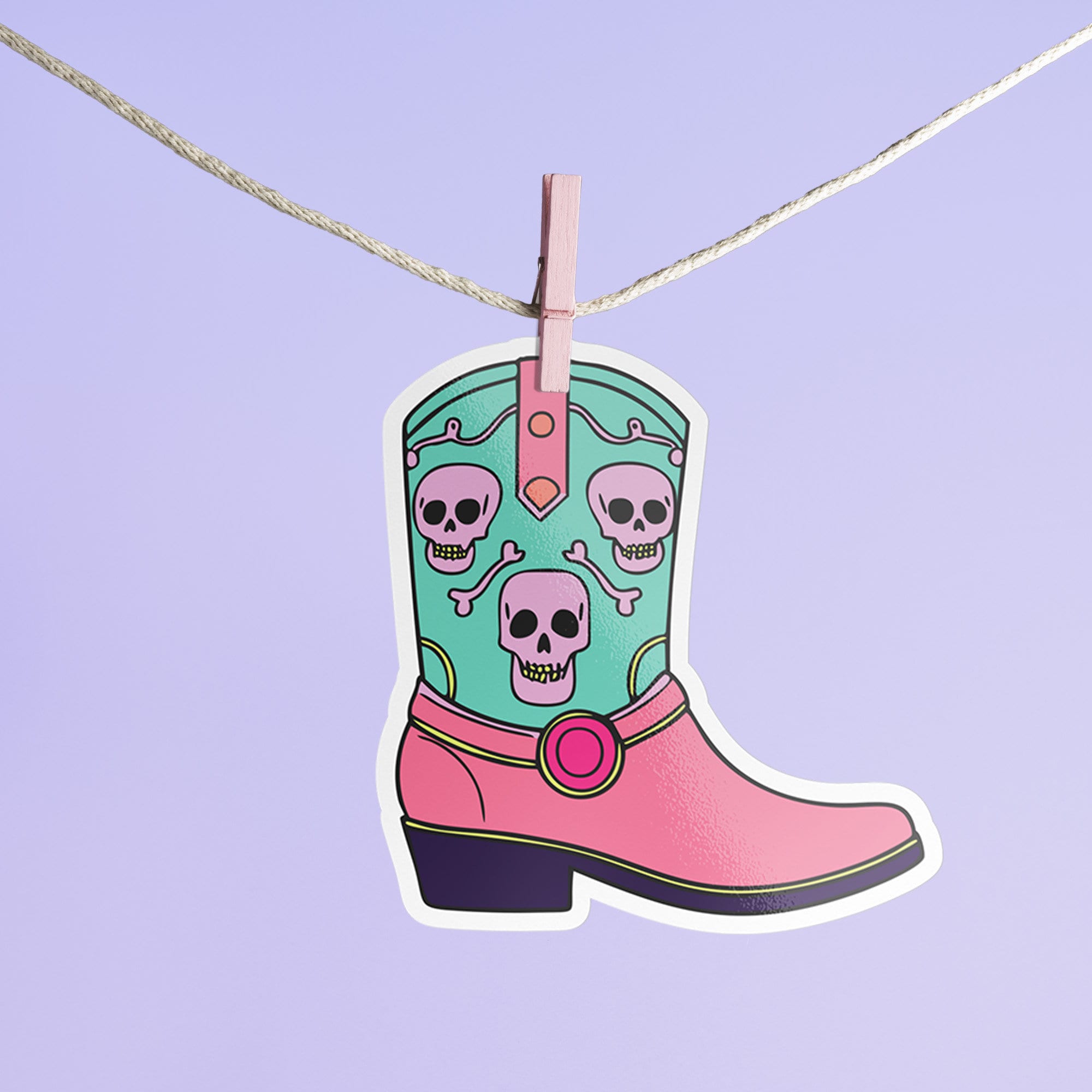 Colorful Goth Cowgirl Boot Sticker with teal and pink boot and skulls, perfect for adding a spooky and quirky touch to your belongings.